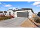 New single-story home with a 2-car garage and desert landscaping at 1130 W Avalon Canyon Dr, Casa Grande, AZ 85122