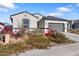 New construction home with front yard landscaping and gray garage door at 1130 W Avalon Canyon Dr, Casa Grande, AZ 85122