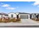 Single story home with gray garage door and drought-tolerant landscaping at 1130 W Avalon Canyon Dr, Casa Grande, AZ 85122