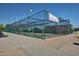 Outdoor batting cages with protective netting and ample space at 1201 E Campbell Ave, Gilbert, AZ 85234