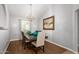 Formal dining room with hardwood floors and elegant chandelier at 1201 E Campbell Ave, Gilbert, AZ 85234