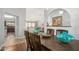 Dining room with dark wood table, chandelier, and view of kitchen at 1201 E Campbell Ave, Gilbert, AZ 85234