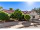 Single-story home with red tile roof, two-car garage, and beautiful landscaping at 1201 E Campbell Ave, Gilbert, AZ 85234