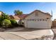 Single-story home with red tile roof, two-car garage, and well-manicured lawn at 1201 E Campbell Ave, Gilbert, AZ 85234