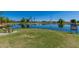 Community lake with seating and fishing access at 1201 E Campbell Ave, Gilbert, AZ 85234