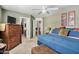 Spacious bedroom with a king-size bed and ample closet space at 12443 W Via Camille Dr, El Mirage, AZ 85335