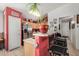 Kitchen boasts stainless steel appliances and red accents at 12443 W Via Camille Dr, El Mirage, AZ 85335