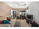 Living room with built-in desk and TV at 12443 W Via Camille Dr, El Mirage, AZ 85335