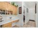 Home office with built-in wooden cabinets and desk at 12443 W Via Camille Dr, El Mirage, AZ 85335