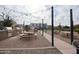 Community grilling area with picnic tables and string lights at 1255 N Arizona Ave # 1148, Chandler, AZ 85225