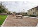 Community playground with wood play structures and shaded seating at 1255 N Arizona Ave # 1148, Chandler, AZ 85225