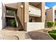 Exterior view of condo building showing stairs and landscaping at 1295 N Ash St # 913, Gilbert, AZ 85233