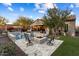 Relaxing backyard with a pool, fire pit, and lounge area at 13213 W Duane Ln, Peoria, AZ 85383