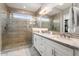 Spa-like bathroom with double vanity, large shower, and modern tile work at 13213 W Duane Ln, Peoria, AZ 85383