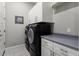 Bright laundry room with washer, dryer and extra storage at 13213 W Duane Ln, Peoria, AZ 85383