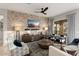 Comfortable living room with stone accent wall and fireplace at 13213 W Duane Ln, Peoria, AZ 85383