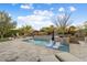 Luxury pool with spa and water features, surrounded by a spacious patio at 13213 W Duane Ln, Peoria, AZ 85383