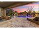 Stunning pool and spa with a covered patio and lounge chairs at 13213 W Duane Ln, Peoria, AZ 85383