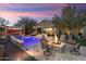 Entertain by the pool and fire pit on a beautiful evening at 13213 W Duane Ln, Peoria, AZ 85383