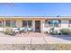 Inviting condo exterior featuring a patio and landscaping at 13609 N Newcastle Dr, Sun City, AZ 85351