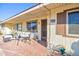 Condo exterior with patio furniture and brick walkway at 13609 N Newcastle Dr, Sun City, AZ 85351