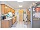 Modern kitchen with stainless steel appliances and wood cabinets at 13609 N Newcastle Dr, Sun City, AZ 85351