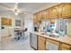 Kitchen features stainless steel appliances and light wood cabinets at 13609 N Newcastle Dr, Sun City, AZ 85351