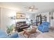 Comfortable living room with leather sofas and wood accents at 13609 N Newcastle Dr, Sun City, AZ 85351