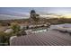 Aerial view of a luxurious home with a pool and expansive desert landscape at 14235 E Dale Ln, Scottsdale, AZ 85262