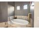 Relaxing bathroom with freestanding oval soaking tub at 14235 E Dale Ln, Scottsdale, AZ 85262