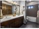 Bathroom with double vanity and a large bathtub at 14235 E Dale Ln, Scottsdale, AZ 85262