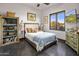 Cozy bedroom with mountain views and built-in shelving at 14235 E Dale Ln, Scottsdale, AZ 85262