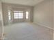 Spacious bedroom with large bay window and carpeted floor at 14838 S 47Th Way, Phoenix, AZ 85044