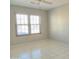 Well-lit bedroom featuring tile floors and large windows at 14838 S 47Th Way, Phoenix, AZ 85044