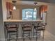 Kitchen boasts a breakfast bar with seating for three at 14838 S 47Th Way, Phoenix, AZ 85044