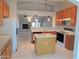 Well-equipped kitchen with island and views to the living room at 14838 S 47Th Way, Phoenix, AZ 85044