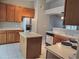 Galley kitchen with white appliances and wood cabinets at 14838 S 47Th Way, Phoenix, AZ 85044