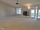 Spacious living room featuring a fireplace and access to a patio at 14838 S 47Th Way, Phoenix, AZ 85044