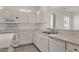 Modern kitchen with white cabinets, updated countertops, and dishwasher at 15158 W Camino Estrella Dr, Surprise, AZ 85374