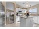 Kitchen with white cabinets, an island, and stainless steel appliances at 1658 S Oak St, Gilbert, AZ 85233