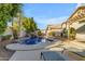 Relaxing backyard oasis with a sparkling pool and waterfall feature at 1658 S Oak St, Gilbert, AZ 85233