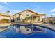 Inviting kidney-shaped pool with a pergola and lounge chairs at 1658 S Oak St, Gilbert, AZ 85233