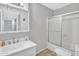 Bright bathroom with a tub, shower, and vanity at 1732 E Baker Dr, Tempe, AZ 85282