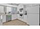 Well-equipped kitchen featuring white cabinets and tile floors at 1732 E Baker Dr, Tempe, AZ 85282