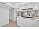 Modern kitchen with white cabinets and a convenient kitchen island at 1732 E Baker Dr, Tempe, AZ 85282