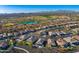 Aerial perspective of a large community with golf course and mountain views at 17817 E Cindercone Rd, Rio Verde, AZ 85263