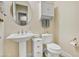 Powder room with pedestal sink and white fixtures at 17817 E Cindercone Rd, Rio Verde, AZ 85263