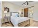 Cozy bedroom with wood flooring and barn door to bathroom at 17817 E Cindercone Rd, Rio Verde, AZ 85263