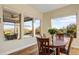 Bright dining room with hardwood floors and view to backyard at 17817 E Cindercone Rd, Rio Verde, AZ 85263