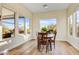 Charming dining room with hardwood floors and view to backyard at 17817 E Cindercone Rd, Rio Verde, AZ 85263